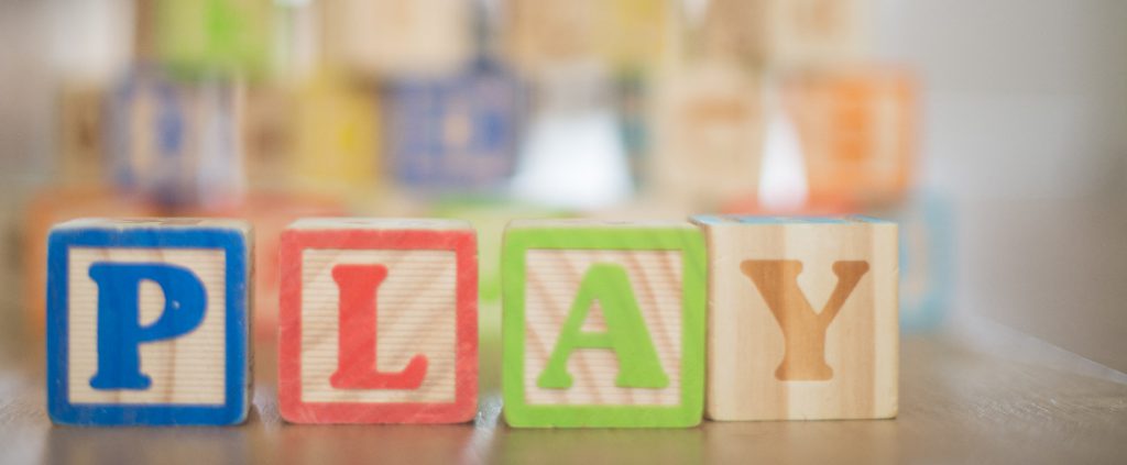 Word Play constructed from wooden toy cubes