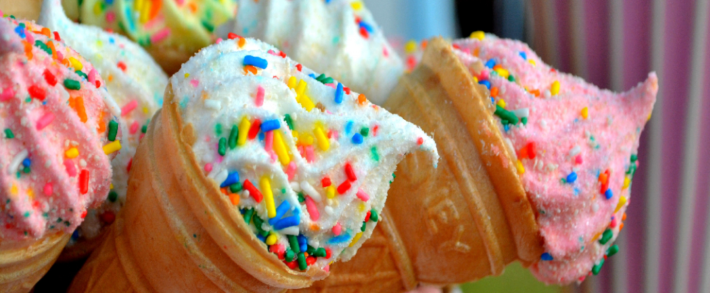 Tasty ice creams with colorful toping